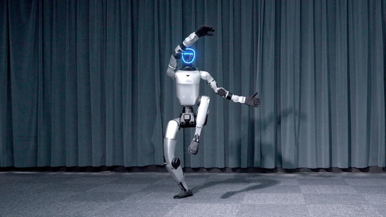 Unitree G1 humanoid robot performing in a studio capability frame.